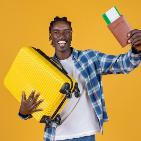 Travelling,Concept.,Portrait,Of,Happy,Black,Young,Man,With,Suitcase